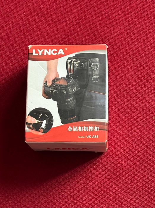 Suport Lynca UK-A8S pentru atasarea camerei foto la curea