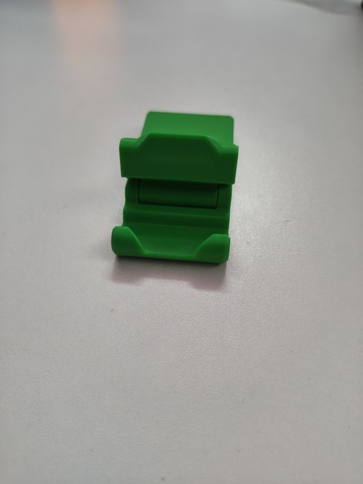 Мини стойка за телефон – малка, но изненадващо стабилна