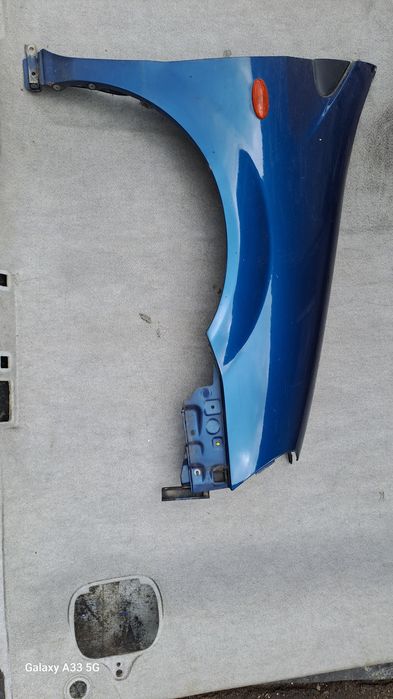 калник Nissan Almera Tino  2000-2006