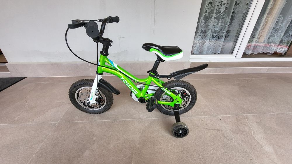 Bicicleta  copii 2-4 aniKidsCare,12 inch
Bicicleta pentru copii 2-4 ani HappyCycles KidsCare, roti 12 inch, cu roti ajutatoare si frane pe disc, verde