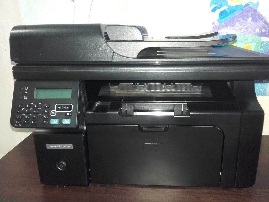 Като нов! Лазерен принтер,скенер и копир 3 в 1 HP LaserJet M1212nf MFP с мрежа и ADF