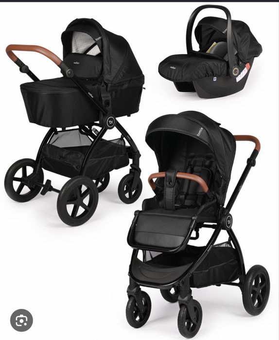 Это универсальная коляска TOMIX Walker Lux в черном цвете. 3 в 1