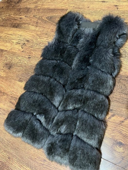 Пухен елек, чисто нов