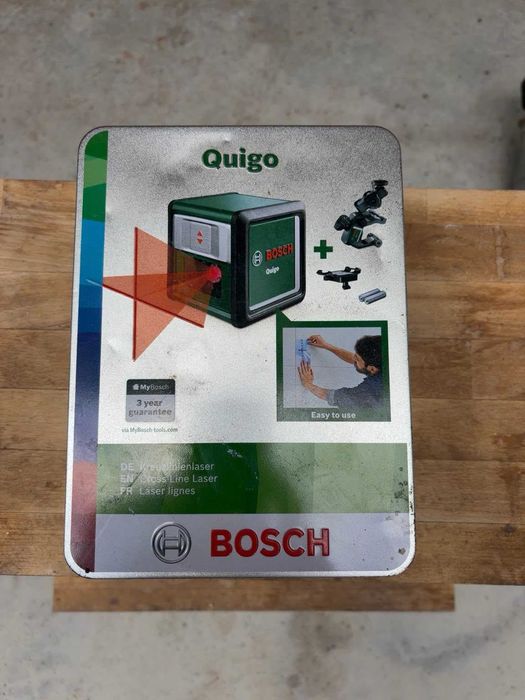 Bosch Quigo Laser cu Linii Incrucisate + Clema Universala MM2 + Cutie Metalica Originala