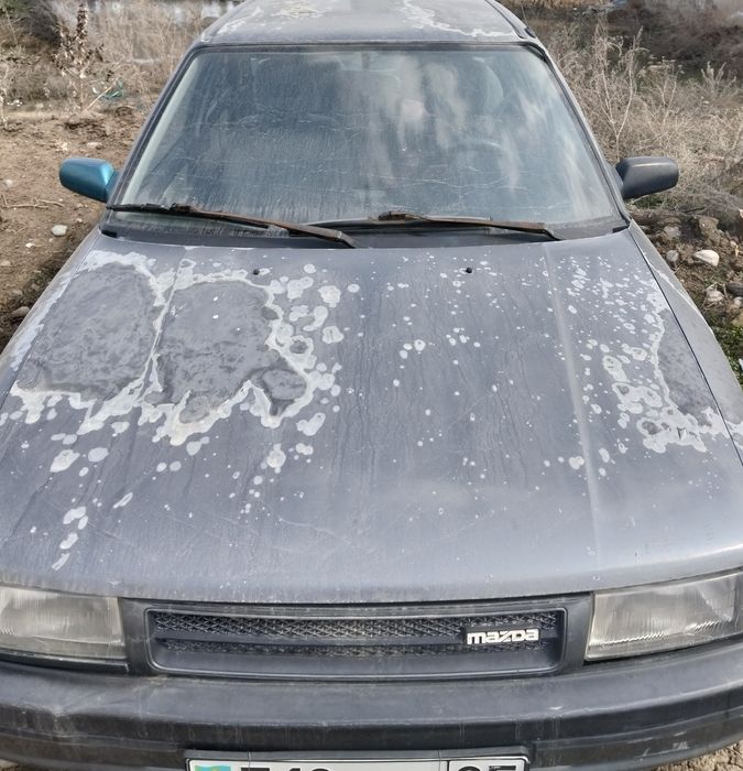 Машина Мазда 323
