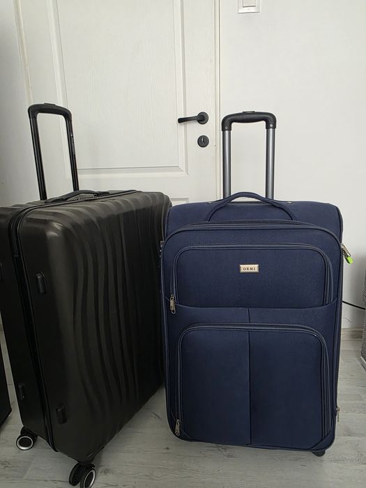 2 troli de bagaje în stare buna