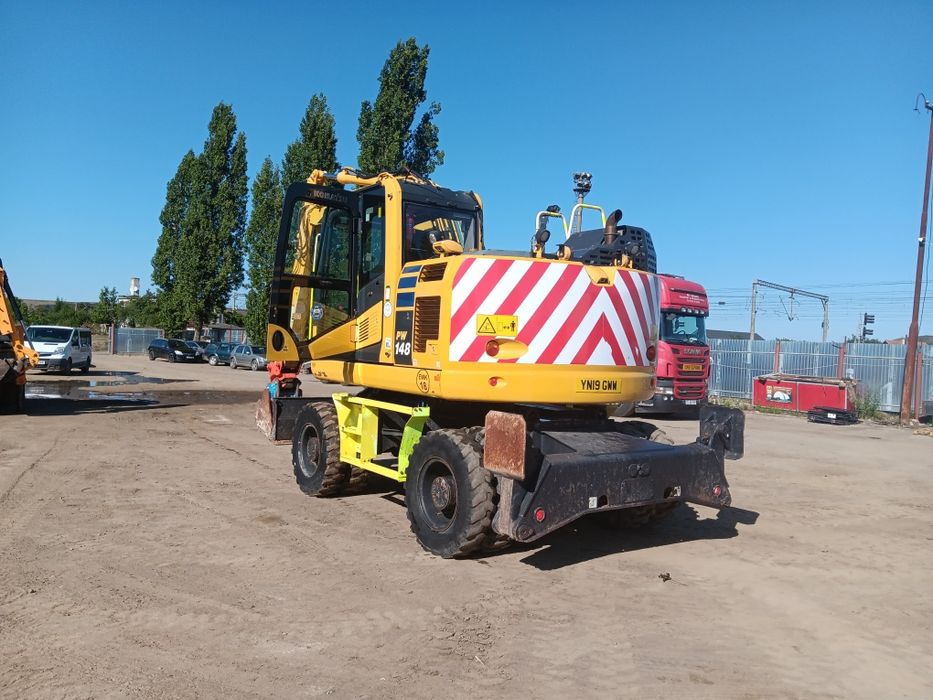 Vând sau schimb excavator komatsu PW 148