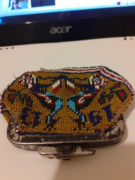 Старо портмоне на 112 години