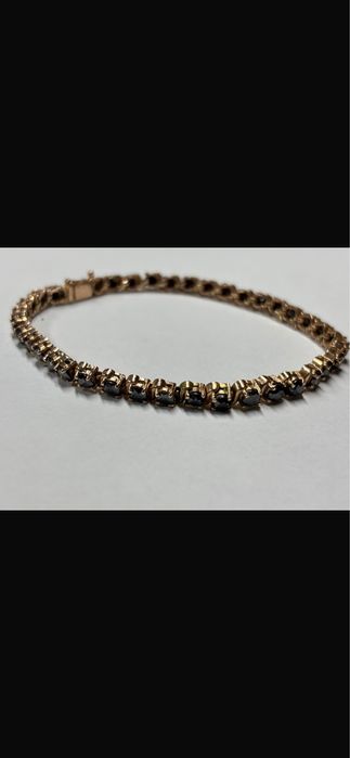 Brățara de  aur cu diamante negre
