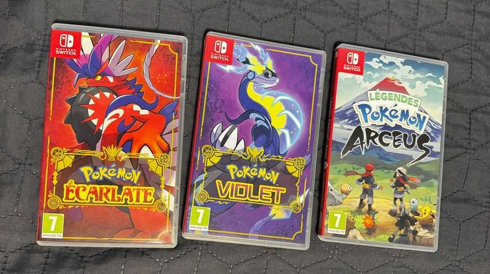 Nintendo Switch OLED + 3 jocuri Pokemon + folie + carcasa – stare foarte buna