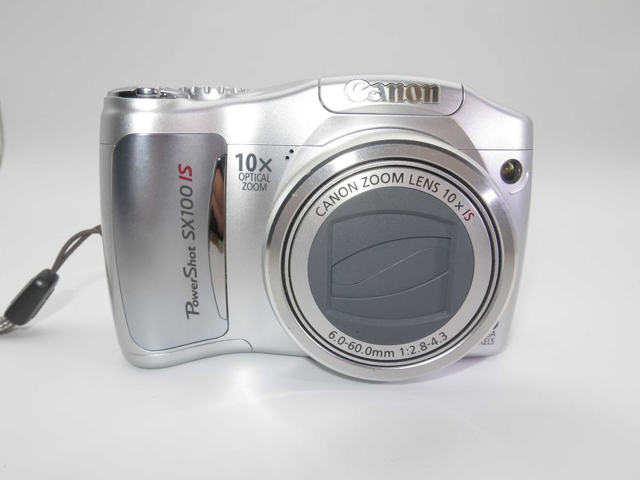 Canon PowerShot SX100 компактен цифров фотоапарат в сребърен цвят, дигитална камера в отлично състояние, 10х оптичен зум, 8MP, тестван работи супер