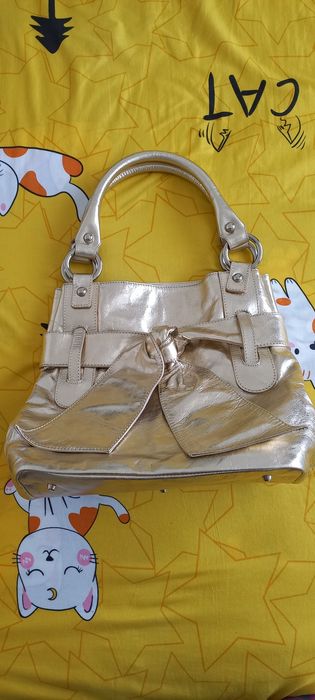 Vând geanta  piele naturala  auriu