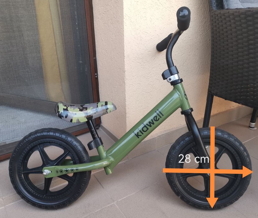 Bicicletă fără pedale pentru echilibru Kidwell REBEL 12” Kaki – roți EVA – stare foarte bună
