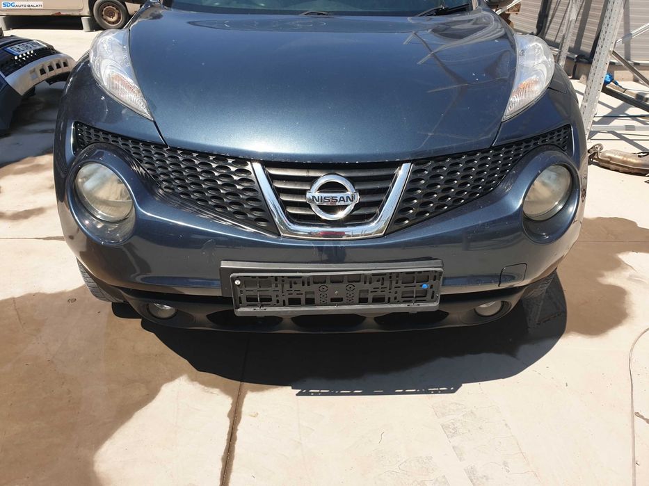 Bara Spoiler Fata cu Proiectoare FARA Grila cu Emblema Nissan Juke F15 NFL Non Facelift 2010 - 2014 Culoare RAQ [K6302]