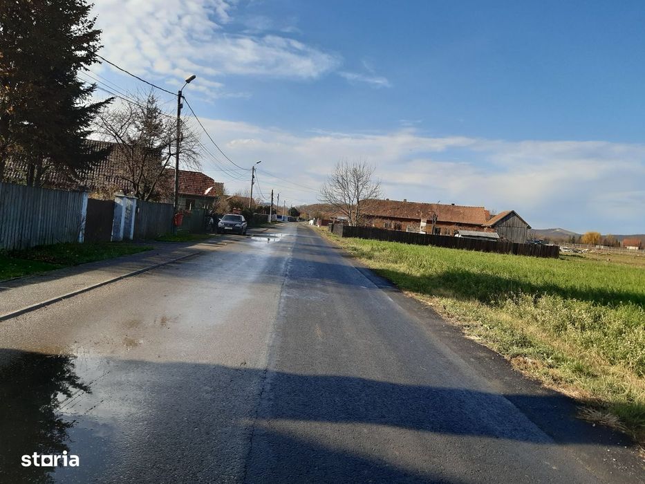 Vand teren construibil intravilan utilitati drum asfaltat central