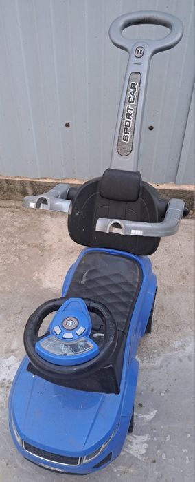 Masinuta copii Nelik, plastic, greutate maxima 27 kg, albastru, cu melodii, maner de impins pentru parinti