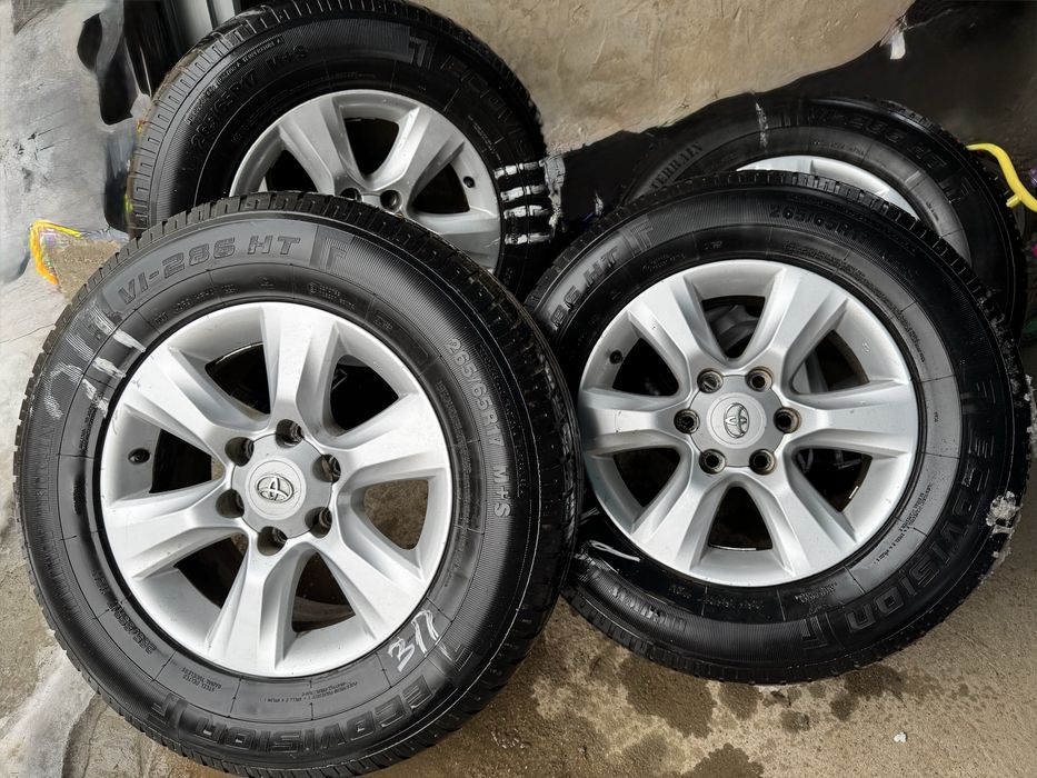 Продам штатные титановые диски с летней резиной на Прадо 150