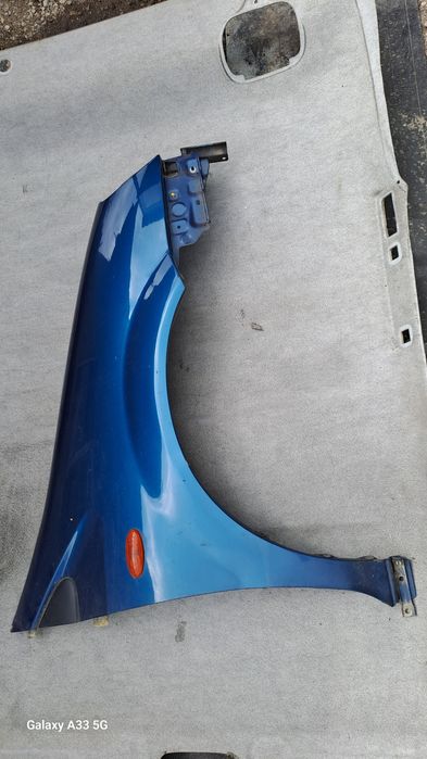 калник Nissan Almera Tino  2000-2006