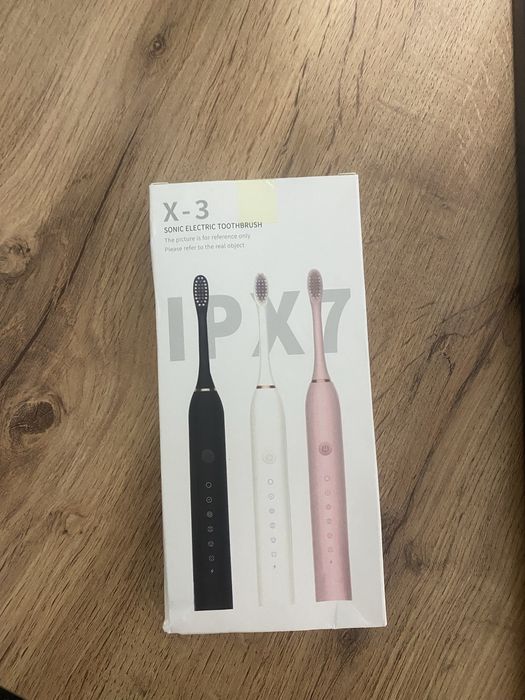 Электрическая зубная щетка