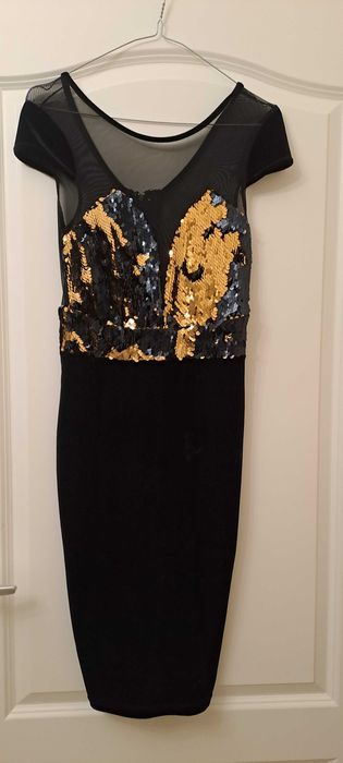 Rochie cu paiete purtata o data marimea 36.Pret 350 ron.