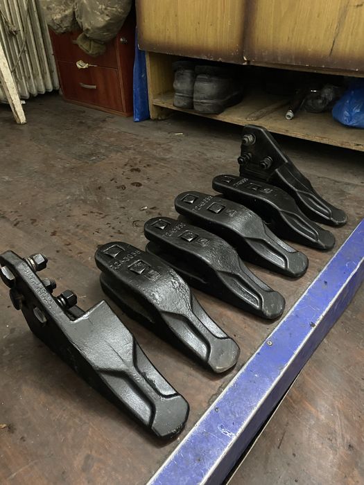 Зубья на ковш 1.8