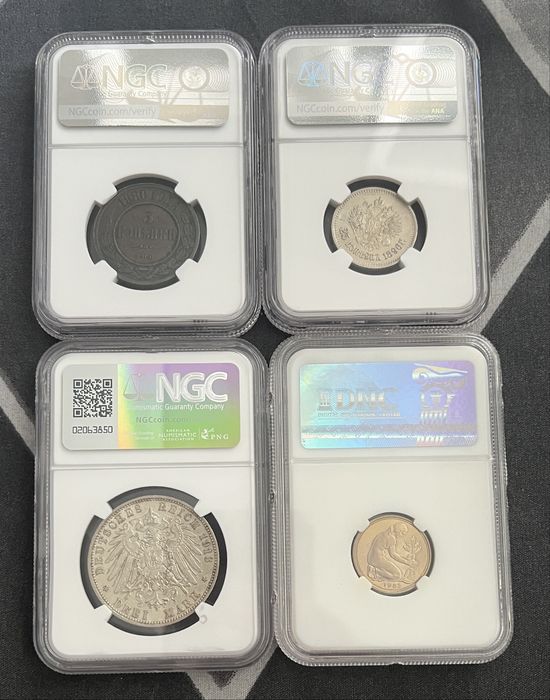 Монеты в слабах DNC, CPRC и NGC.