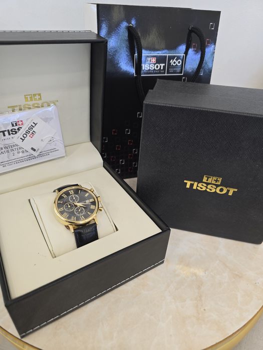 Продам золотые часы Tissot