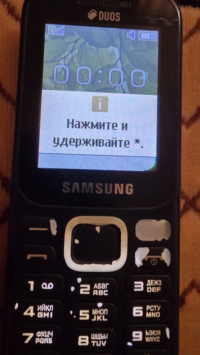 Телефон кнопочный.