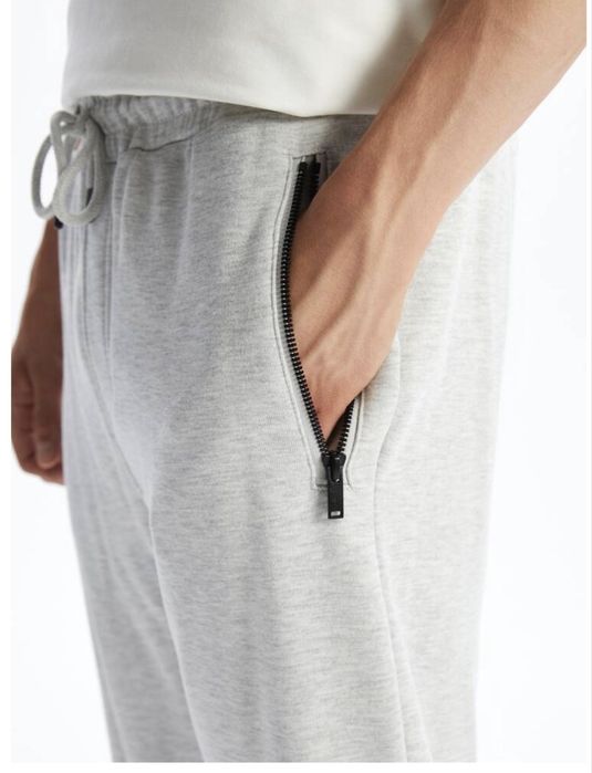 Продам новое трико серое