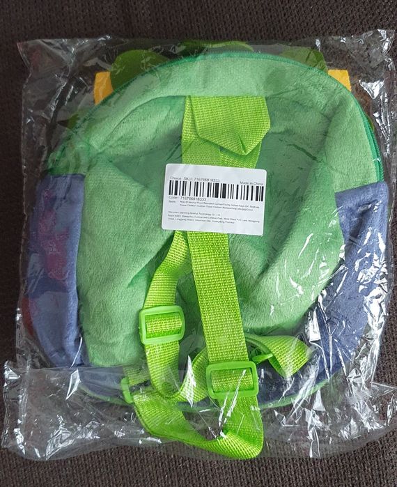 Зелена малка раница във формата на динозавър