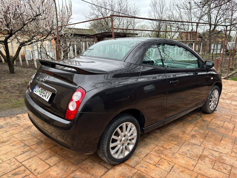Nissan Micra 1,6 benzina decapotabil,  impecabil  Accept schimb cu  autoturisme s-au cu oi.