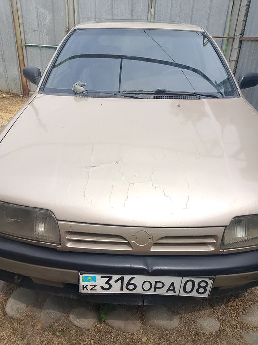 Машина Ниссан примера