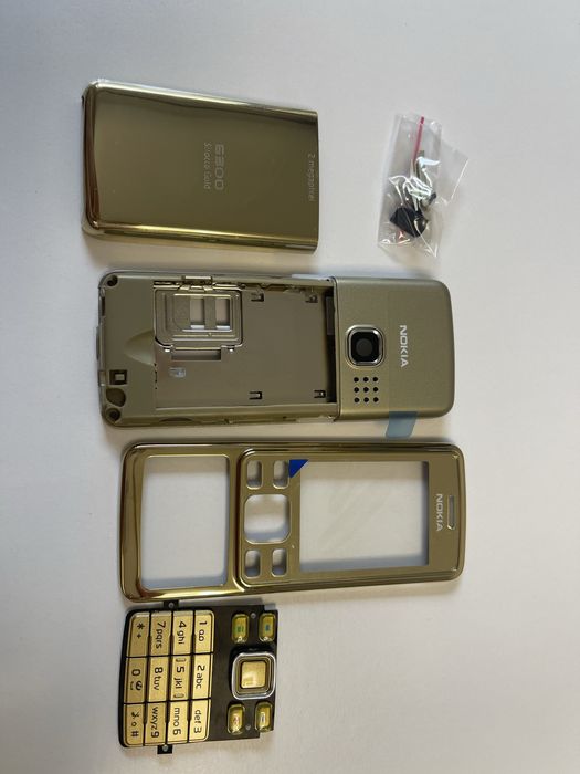 Vând carcasa Nokia 6300 Sirocco Gold