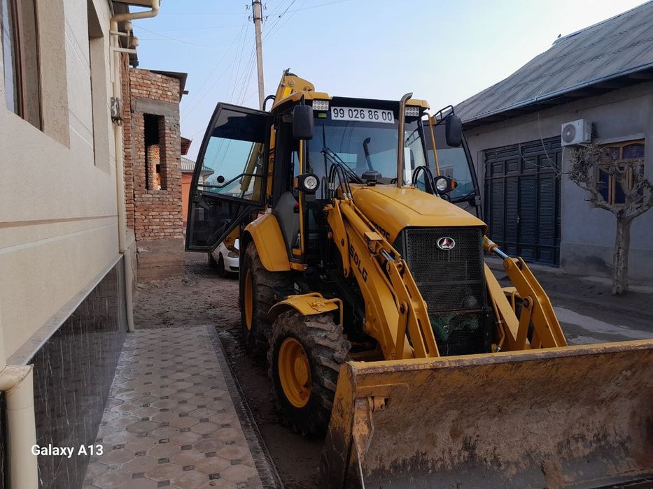 Экскаватор погрузчик Volvo SDLG