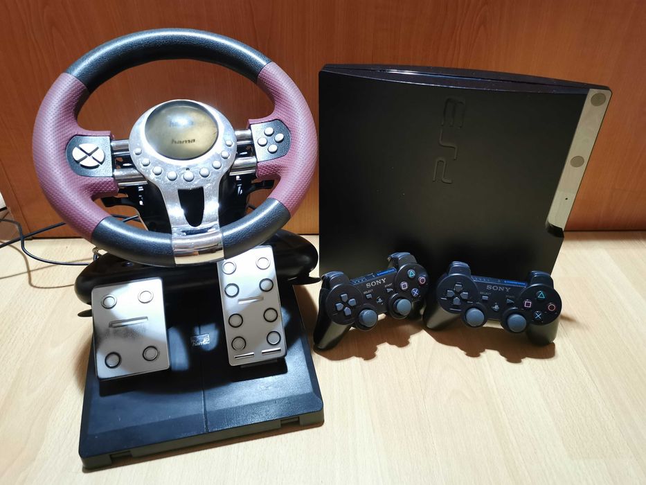 PS3 cu volan si pedale + 50 jocuri bune + 2 manete wireless