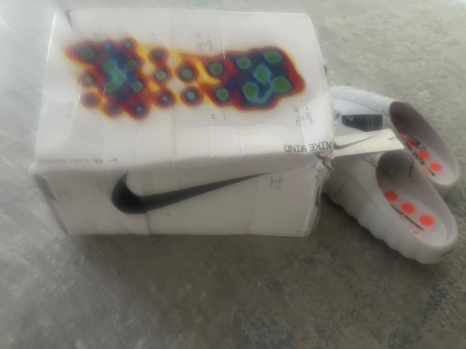 Продам тапочки Nike Mind 001