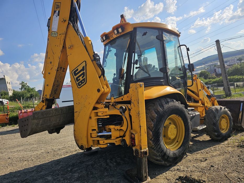 JCB 3CX Sitemaster 2003 – Cupă 4 în 1 + 4 cupe excavare