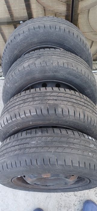 4 jante de tabla cu anvelope de vara si capace originale logan 1