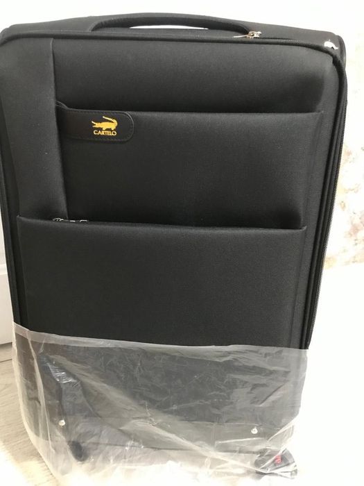 Продам новый чемодан