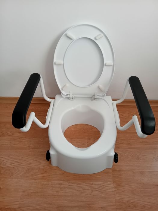 Повдигаща седалка за тоалетна с дръжки