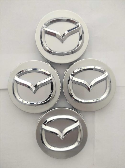 Капачки за Джанти за МАЗДА 56 мм. Цвят: Сребристи, червени и черни.