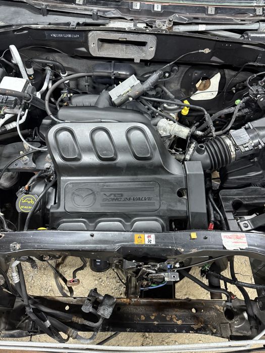 Мазда Tribute привозные запчасти