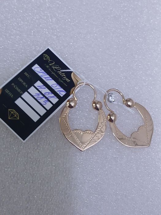 Продам золотые серьги