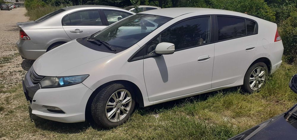 Auto Honda Insight hybrid automata consum 5% bolt uber ride-sharing