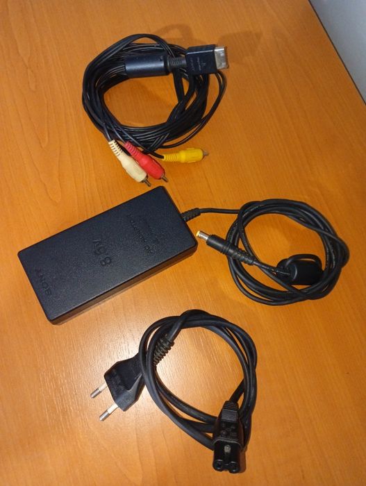 PlayStation 2 Slim + 8 jocuri + manetă