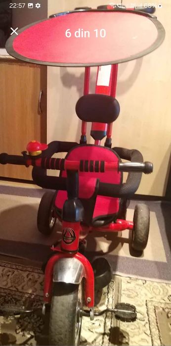 Vând bicicleta cu pedale,  copertină și mâner de ghidare