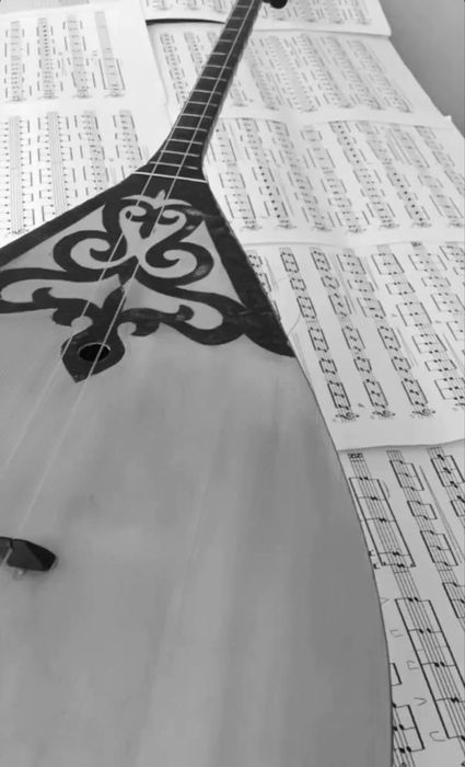 Учитель по домбре