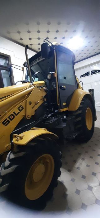 Экскаватор погрузчик Volvo SDLG