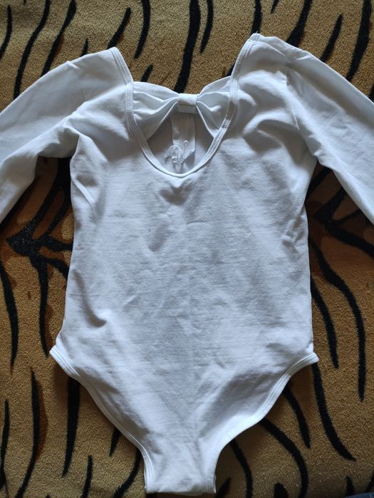 Продам гимнастический купальник на девочку