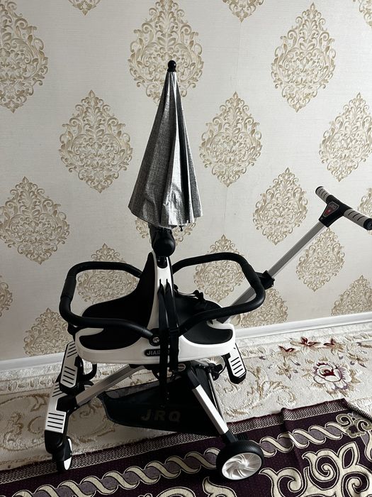 Екі балаға арналған коляска